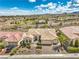 Gorgeous aerial view of a well-maintained desert property with a three-car garage and charming landscaping at 1964 Oliver Springs St, Henderson, NV 89052