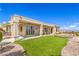 Covered patio with lush lawn, stone landscaping, and views at 1964 Oliver Springs St, Henderson, NV 89052