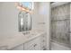 Stylish bathroom with single vanity, modern lighting, and tiled walk-in shower at 1964 Oliver Springs St, Henderson, NV 89052