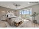 Comfortable bedroom with a large bay window, light-colored walls, and views of the surrounding landscape at 1964 Oliver Springs St, Henderson, NV 89052