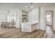 Bright dining room featuring hard surface floors, a built-in wet bar, and an open concept layout at 1964 Oliver Springs St, Henderson, NV 89052