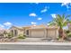 Beautiful single-story home with tile roof, three car garage, and desert landscaping at 1964 Oliver Springs St, Henderson, NV 89052