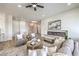 Cozy living room with modern fireplace, plush seating, neutral decor, and ample natural light at 1964 Oliver Springs St, Henderson, NV 89052