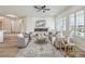 Bright and airy living room featuring a modern fireplace, neutral furniture, and lots of natural light at 1964 Oliver Springs St, Henderson, NV 89052