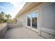 Exterior balcony area featuring sliding glass doors, offering outdoor living space and neighborhood views at 204 N Ring Dove Dr, Las Vegas, NV 89144
