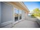 Outdoor balcony with sliding glass doors allowing natural light, beige exterior with view of the neighborhood at 204 N Ring Dove Dr, Las Vegas, NV 89144