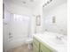Well-lit bathroom featuring a bathtub with shower and vanity with cabinet space offering storage and functionality at 204 N Ring Dove Dr, Las Vegas, NV 89144