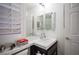 Bathroom featuring a white sink and countertop with white shutters on the window at 204 N Ring Dove Dr, Las Vegas, NV 89144
