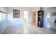 Bright bedroom with tiled floors, featuring easy access to the bathroom and closet, providing comfort and convenience at 204 N Ring Dove Dr, Las Vegas, NV 89144