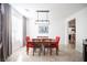 Well-lit dining room with table, chairs, modern light fixture, and neutral decor at 204 N Ring Dove Dr, Las Vegas, NV 89144