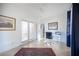 Home office with bright natural light, ceiling fan, decorative rug, and exterior access at 204 N Ring Dove Dr, Las Vegas, NV 89144