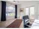 Office space with large window, decorative rug, modern ceiling fan, and natural light at 204 N Ring Dove Dr, Las Vegas, NV 89144