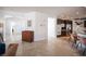Spacious kitchen connected to other rooms, with stainless steel appliances and tile flooring at 204 N Ring Dove Dr, Las Vegas, NV 89144