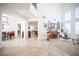 Open-concept living space featuring tile floors, high ceilings, and abundant natural light at 204 N Ring Dove Dr, Las Vegas, NV 89144