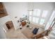 Open living area with a piano, large windows, and a wrought iron balcony at 204 N Ring Dove Dr, Las Vegas, NV 89144