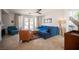 Inviting living room with comfortable seating, neutral walls, and backyard access at 204 N Ring Dove Dr, Las Vegas, NV 89144
