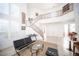 Bright living room with staircase, light-colored tile floors, and modern furniture at 204 N Ring Dove Dr, Las Vegas, NV 89144