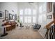 Bright, grand living room with high ceilings, large windows, and elegant decor at 204 N Ring Dove Dr, Las Vegas, NV 89144