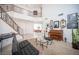 Open-concept living room with high ceilings, staircase, and stylish decor, perfect for entertaining at 204 N Ring Dove Dr, Las Vegas, NV 89144