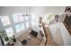 Bright open living room with high ceilings, large windows, and a wrought iron staircase at 204 N Ring Dove Dr, Las Vegas, NV 89144