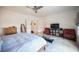 Well-lit main bedroom featuring tile floors, ceiling fan, and decor at 204 N Ring Dove Dr, Las Vegas, NV 89144