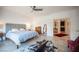 Inviting main bedroom featuring tiled floors, ceiling fan, and decor at 204 N Ring Dove Dr, Las Vegas, NV 89144