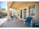 Charming covered patio featuring comfortable seating and direct access to the backyard pool area at 204 N Ring Dove Dr, Las Vegas, NV 89144