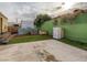 This backyard has a mix of concrete, artificial turf, and planter beds offering varied outdoor space at 2060 Toiyabe St, Las Vegas, NV 89156