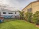 A backyard featuring an artificial lawn, providing a low-maintenance green space at 2060 Toiyabe St, Las Vegas, NV 89156