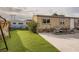 Turf lawn and patio area offer a great place to relax and play outside at 2060 Toiyabe St, Las Vegas, NV 89156