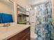 Bathroom featuring a shower-tub combo with stylish curtain and a single sink vanity at 2060 Toiyabe St, Las Vegas, NV 89156