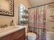 Bathroom featuring a shower-tub combo with stylish curtain and a charming vanity at 2060 Toiyabe St, Las Vegas, NV 89156