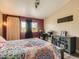 Comfortable bedroom featuring a sliding barn door and a cozy study nook with lots of light at 2060 Toiyabe St, Las Vegas, NV 89156