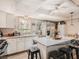 Kitchen features stainless steel appliances, light cabinets, and an island with seating at 2060 Toiyabe St, Las Vegas, NV 89156