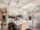 Bright kitchen featuring stainless steel appliances, a center island, and plenty of storage space at 2060 Toiyabe St, Las Vegas, NV 89156