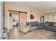Living room boasts stylish, wood-look flooring and a modern sliding barn door feature at 2060 Toiyabe St, Las Vegas, NV 89156