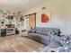 Cozy living area showcases modern decor and wood-look floors, enhancing its inviting atmosphere at 2060 Toiyabe St, Las Vegas, NV 89156