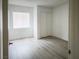 Bright bedroom features closet, window, and wood-look flooring at 2191 Bay Club Dr # 102, Laughlin, NV 89029