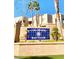 Exterior view of the Colorado Bay Club signage with mature landscaping on a sunny day at 2191 Bay Club Dr # 102, Laughlin, NV 89029