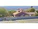 Rear exterior view of the home with a desert landscape and a block wall at 2191 Bay Club Dr # 102, Laughlin, NV 89029