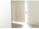Light filled room showcases vertical blinds and wood-look flooring at 2191 Bay Club Dr # 102, Laughlin, NV 89029