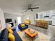 Bright living room with modern furniture, fireplace, and ceiling fan at 2191 Bay Club Dr # 102, Laughlin, NV 89029