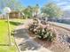 Walkway with landscaping featuring blooming bushes and trees leading to the community homes at 2191 Bay Club Dr # 102, Laughlin, NV 89029