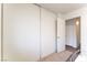 Bedroom closet featuring sliding doors and neutral carpet at 2261 Tall Pine Dr, Las Vegas, NV 89108
