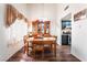 Dining room with wood floors and view to a kitchen with stainless steel appliances at 2261 Tall Pine Dr, Las Vegas, NV 89108