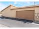 Attached garage with a large door and exterior access at 2261 Tall Pine Dr, Las Vegas, NV 89108