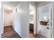 Hallway with wood floors that leads to a bathroom and bedroom at 2261 Tall Pine Dr, Las Vegas, NV 89108