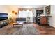 Comfortable living room featuring hardwood floors and a stylish bar area at 2261 Tall Pine Dr, Las Vegas, NV 89108