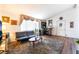 Cozy living room features vaulted ceilings, hardwood floors, and stylish bar at 2261 Tall Pine Dr, Las Vegas, NV 89108