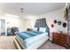 Spacious main bedroom featuring a large bed with stylish blue bedding and a unique headboard, complemented by modern decor at 2261 Tall Pine Dr, Las Vegas, NV 89108